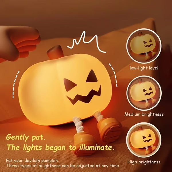 Hand holding compact pumpkin night-light to pack into a weekend travel bag